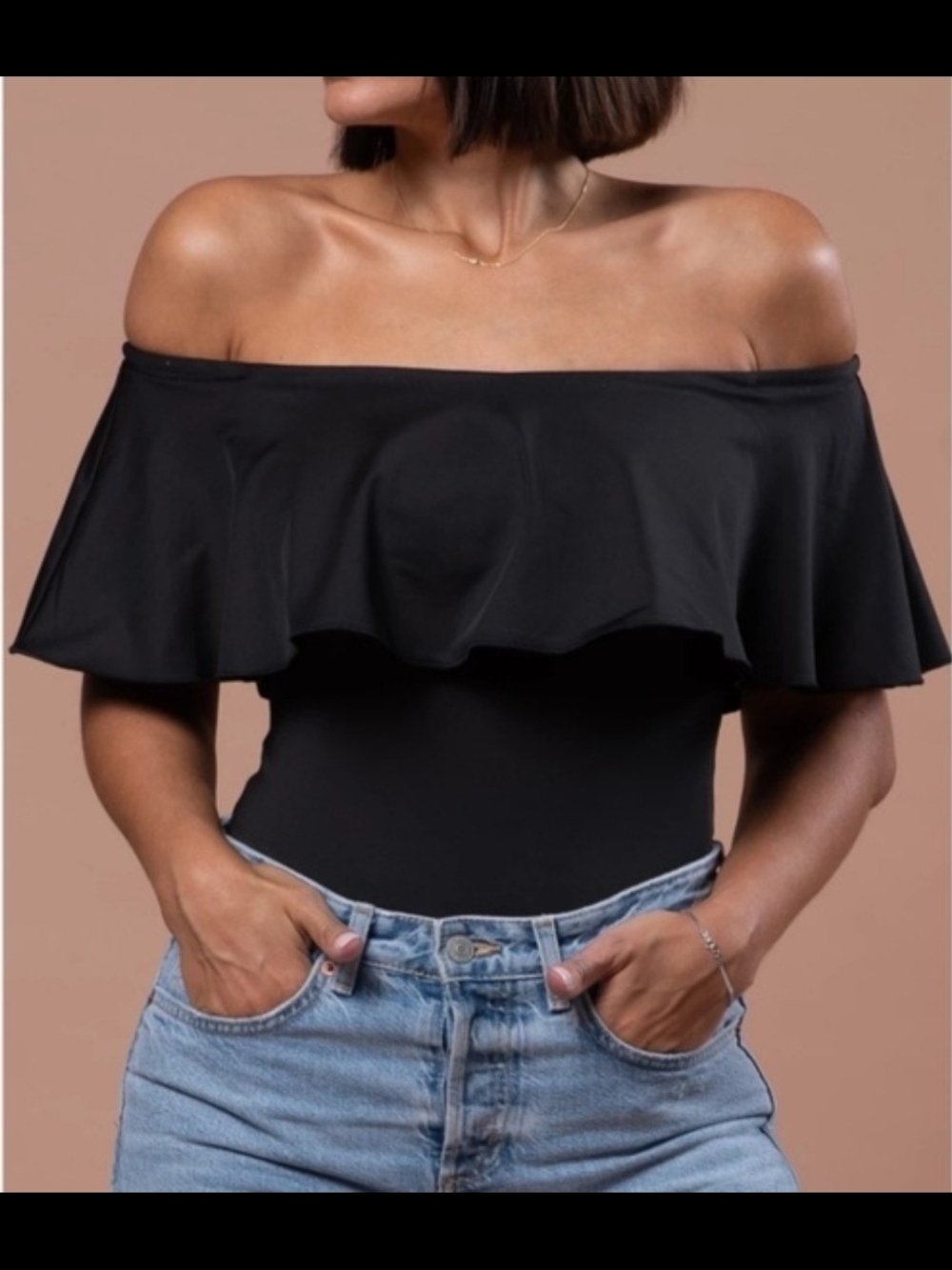 By Egreis Off-Shoulder Ruffle Bodysuit in Black